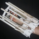 Illustration for article titled 3D-Printed Gatling Gun Fires 48 Rubber Bands in Mere Seconds